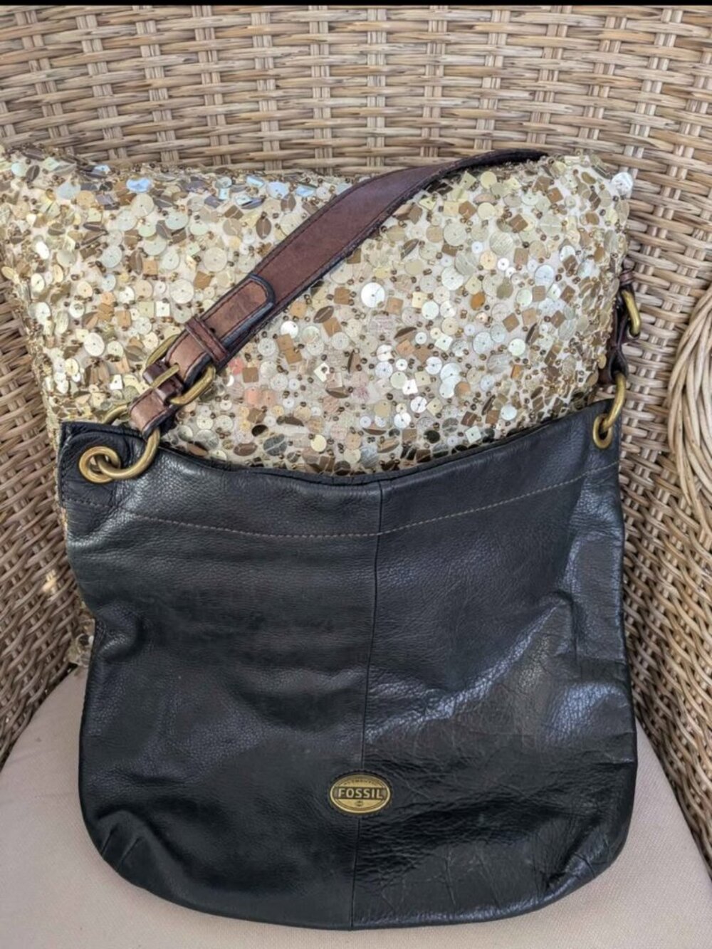 Black leather shoulder bag by Fossil